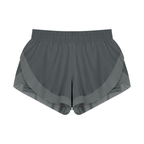 Gray paneled yoga shorts with wide elastic waistband and layered side panels.