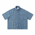 Distressed blue short-sleeve button-up shirt with chest pockets and camp collar