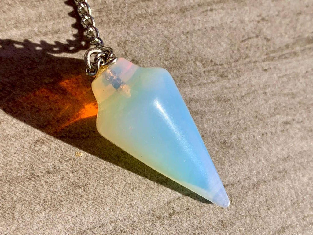 Opalite pendulum bag charm with gold-tone chain and blue opalescent teardrop