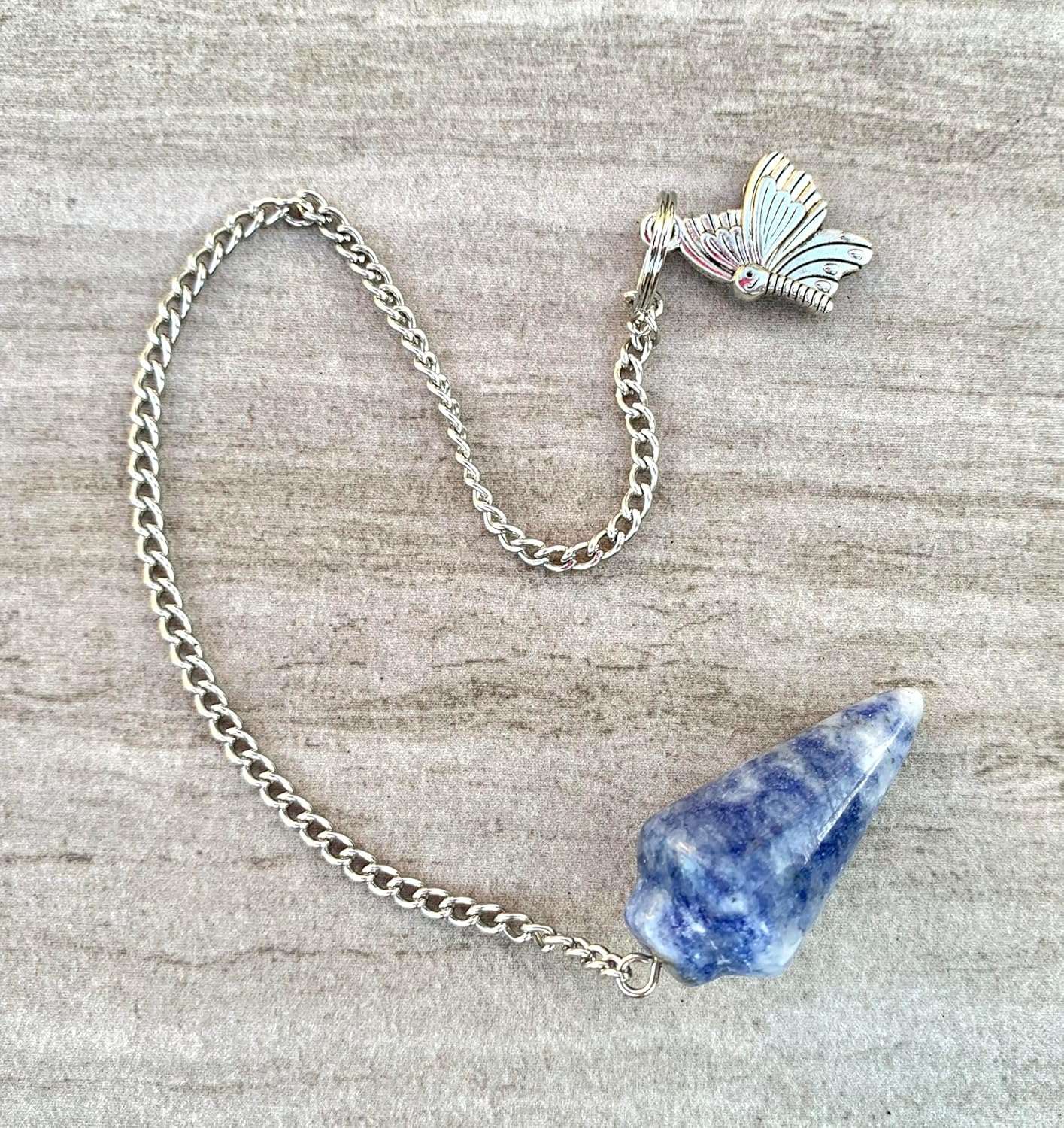 Blue and white crystal pendulum with silver chain and butterfly charm