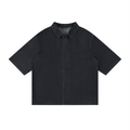 Black vintage-wash lyocell drop-shoulder button-up shirt with pointed collar, short sleeves.