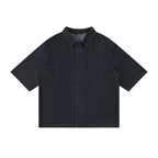 Black vintage-wash lyocell drop-shoulder button-up shirt with pointed collar, short sleeves.