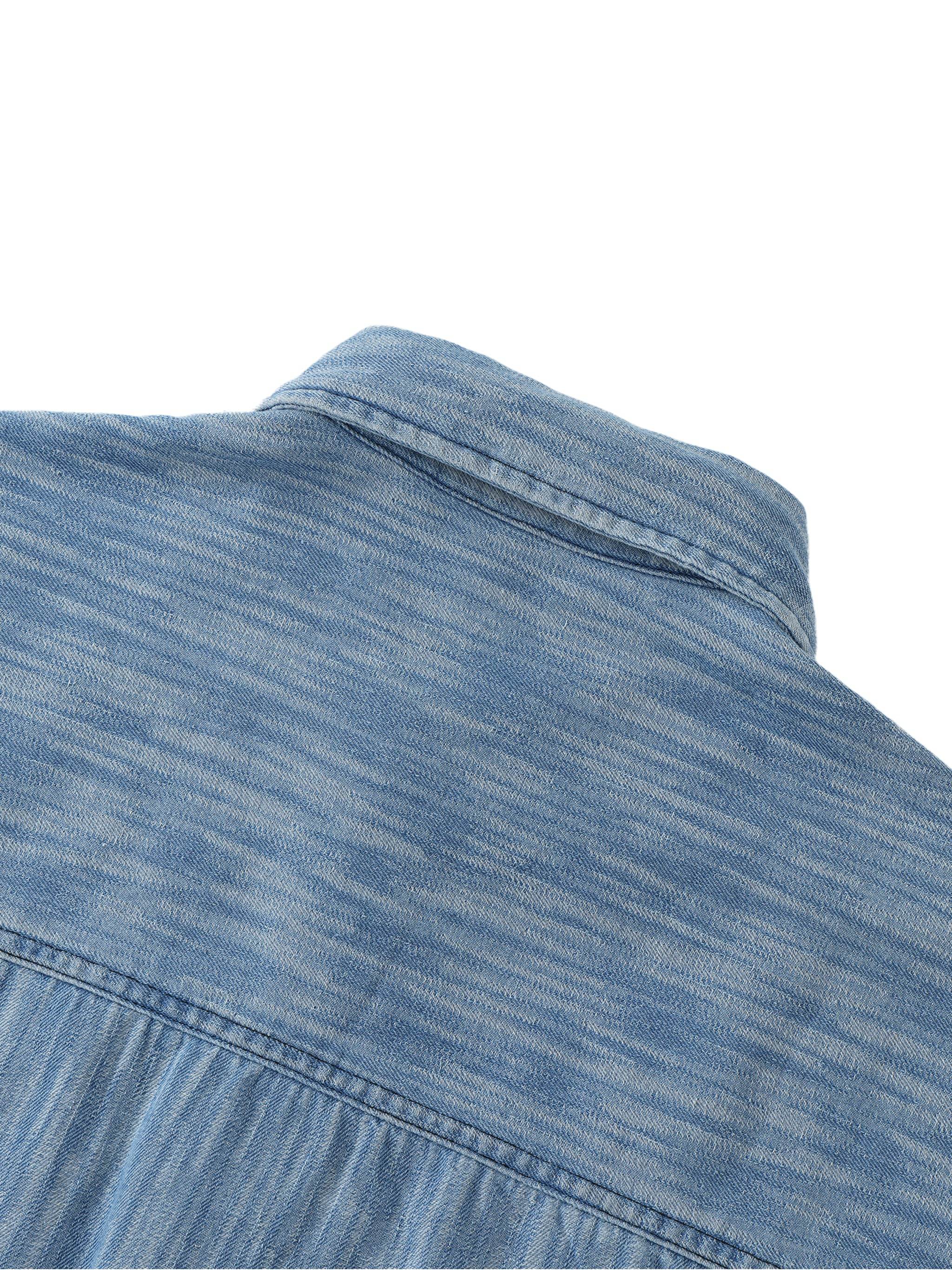 Distressed blue shirt shoulder yoke and collar close-up