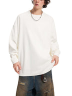 White oversized knit sweatshirt with round neck, long sleeves, relaxed straight hem