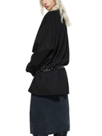 Black oversized knit sweatshirt with round neck, studded waist belt, long loose sleeves