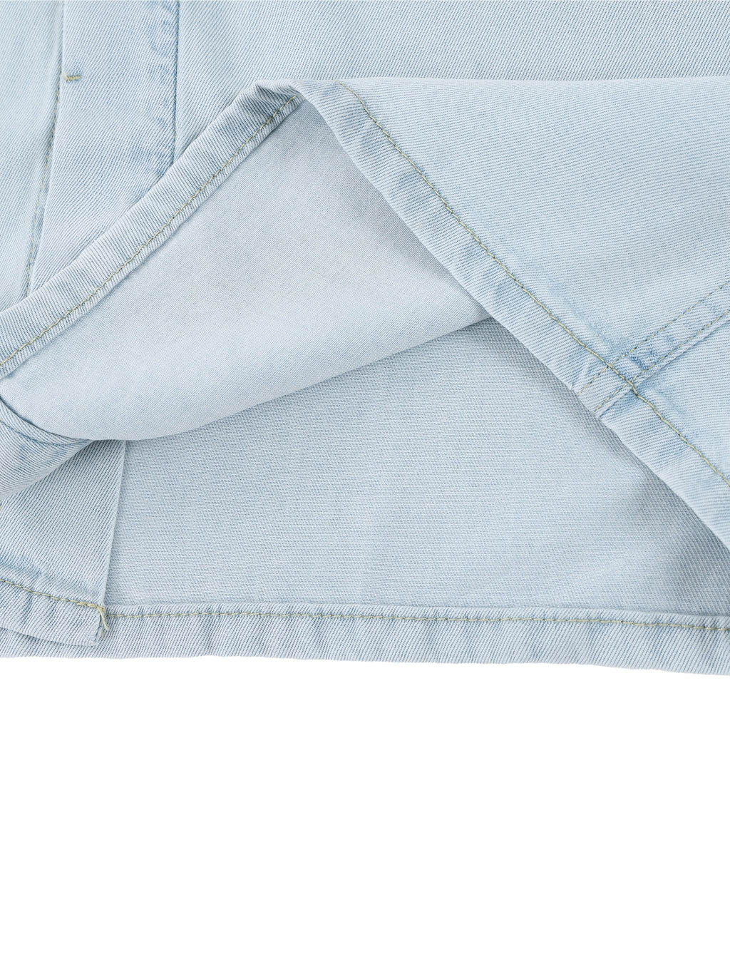 Light blue lyocell shirt hem and side seam detail with stitch lines