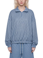 Sky blue plaid quarter-zip sweatshirt with collared zipper and elastic waist hem