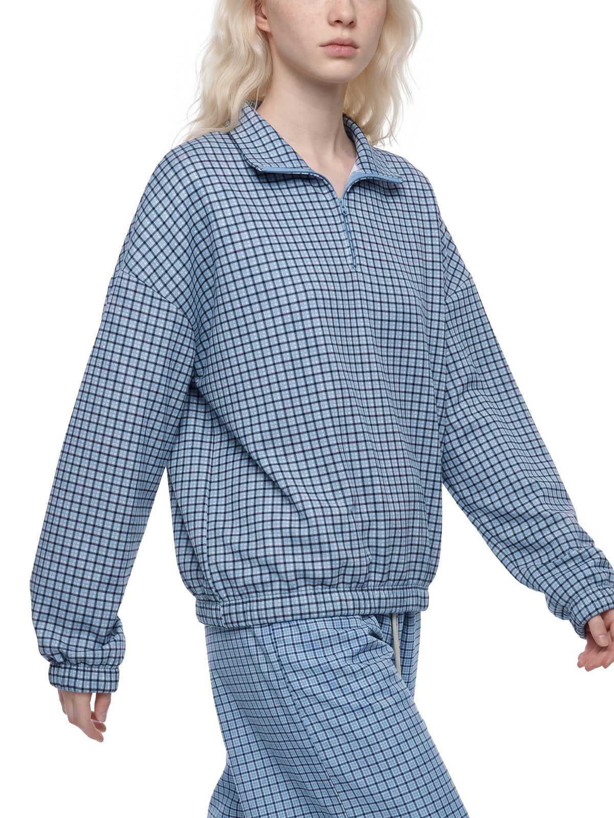 Sky blue plaid quarter-zip sweatshirt with collared neckline and ribbed cuffs