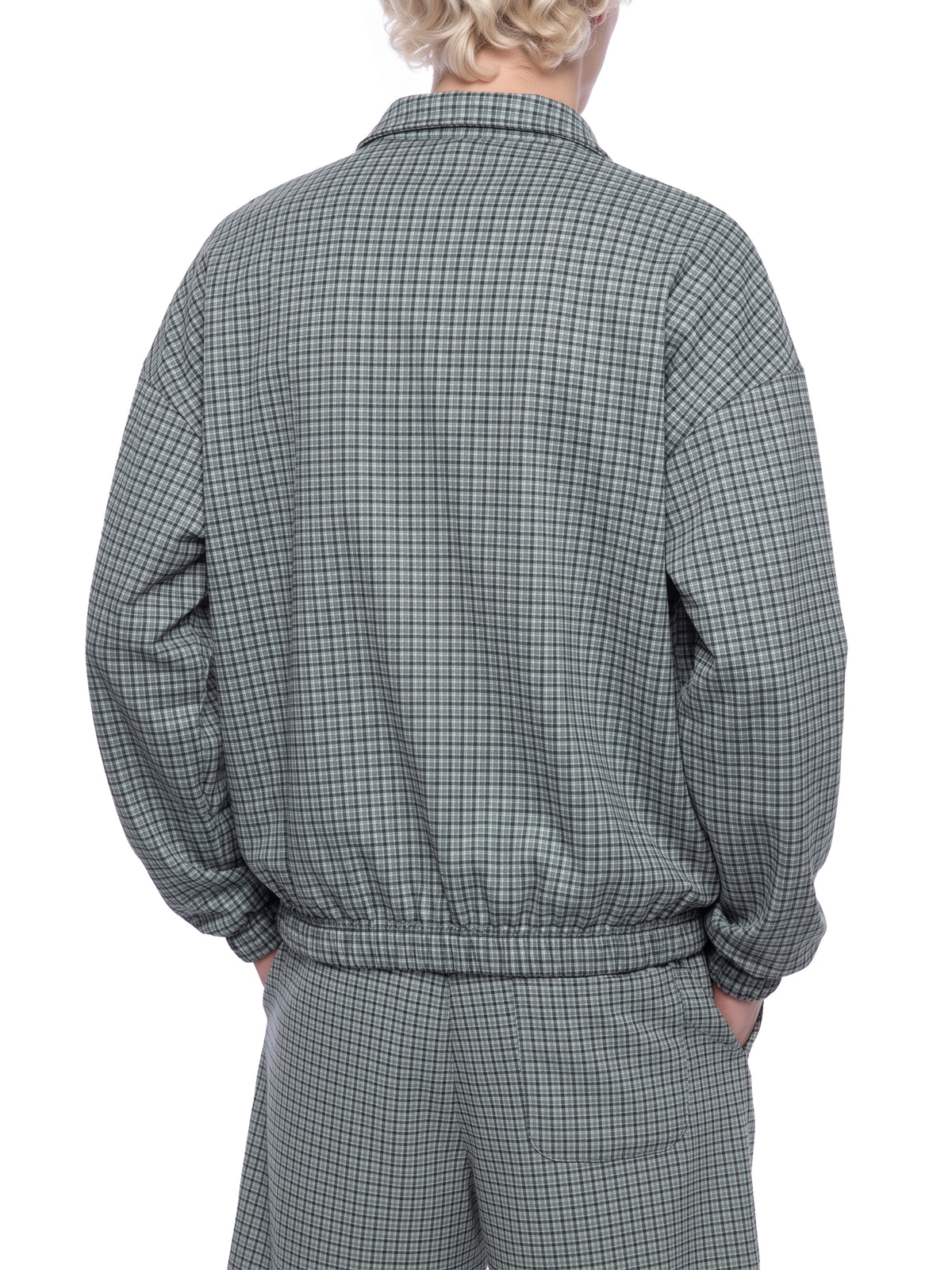 Green plaid quarter-zip sweatshirt with long sleeves and elastic hem cuffs