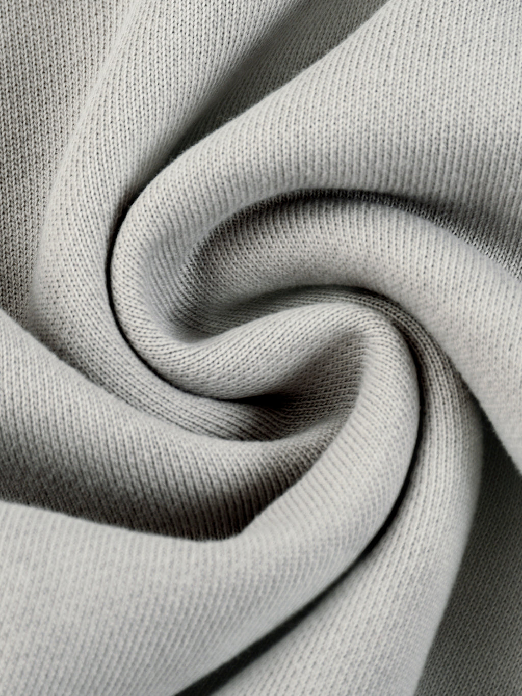 Light gray hoodie knit fabric close-up with soft heather texture