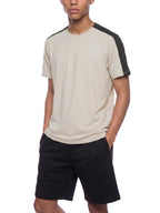 Light beige performance T-shirt with dark charcoal sleeve trim and contrast sides