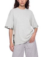 Unisex light gray T-shirt with plaid-trim sleeve cuff and draped relaxed fit