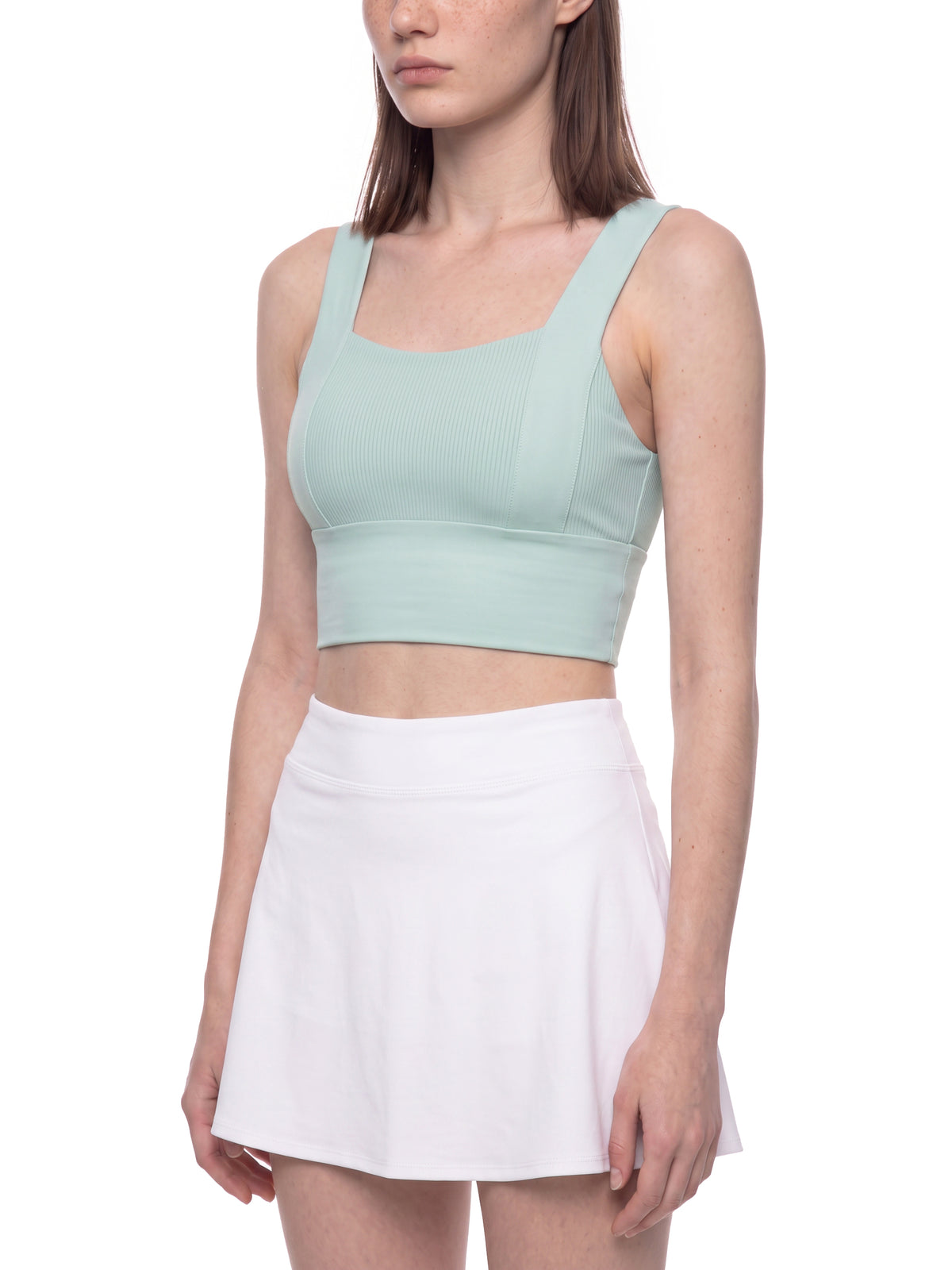 Mint green yoga crop tank top with ribbed front panel and wide supportive straps.