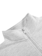 Light gray quarter-zip sweatshirt neckline with metal zipper and ribbed hem