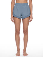 Women’s blue paneled yoga shorts with elastic waistband and built-in-style look