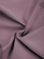 Women’s purple yoga shorts fabric close-up with smooth stretch texture
