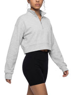 Light gray women’s crop quarter-zip sweatshirt with stand collar and long sleeves