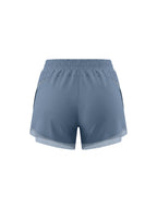 Light blue paneled yoga shorts with wide elastic waistband and airy side hem.