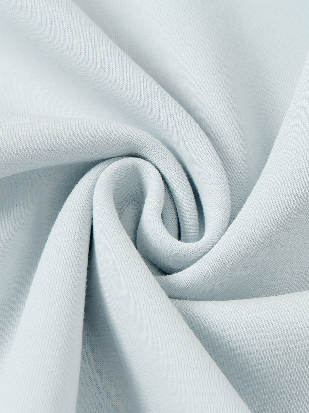 Light blue jacket fabric fold close-up showing soft drape and weave