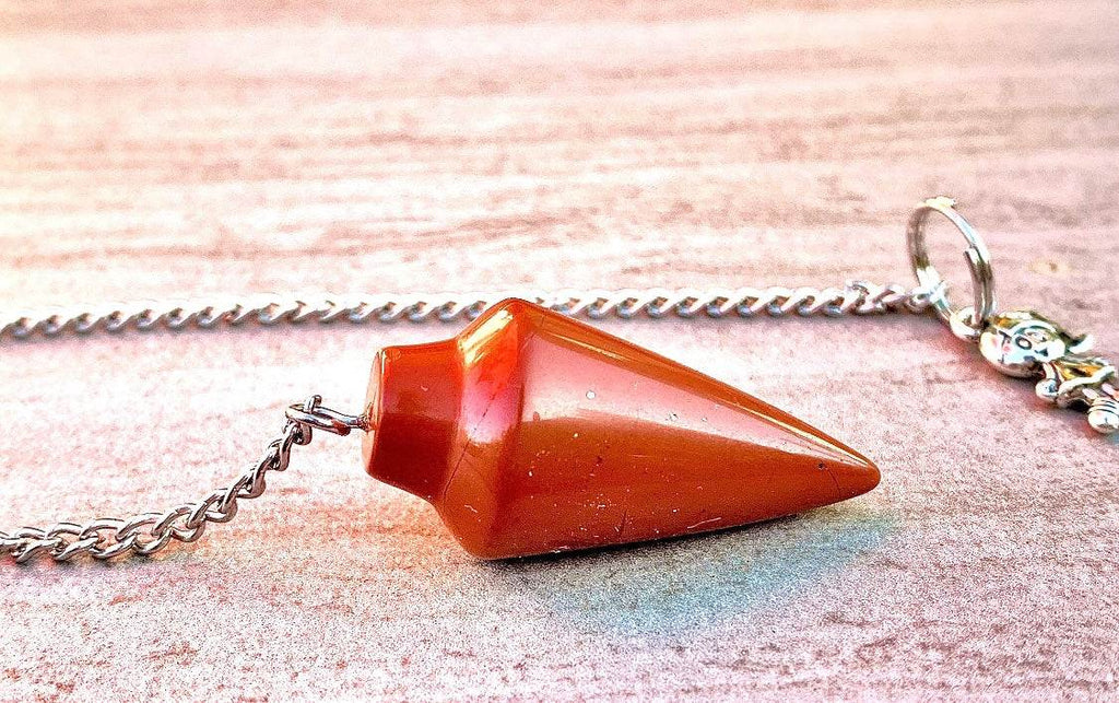 Red jasper pendulum bag charm on silver chain with small dangling charm