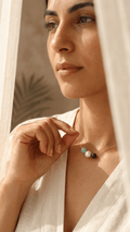 Gold beaded necklace with white pearl and green stone beads