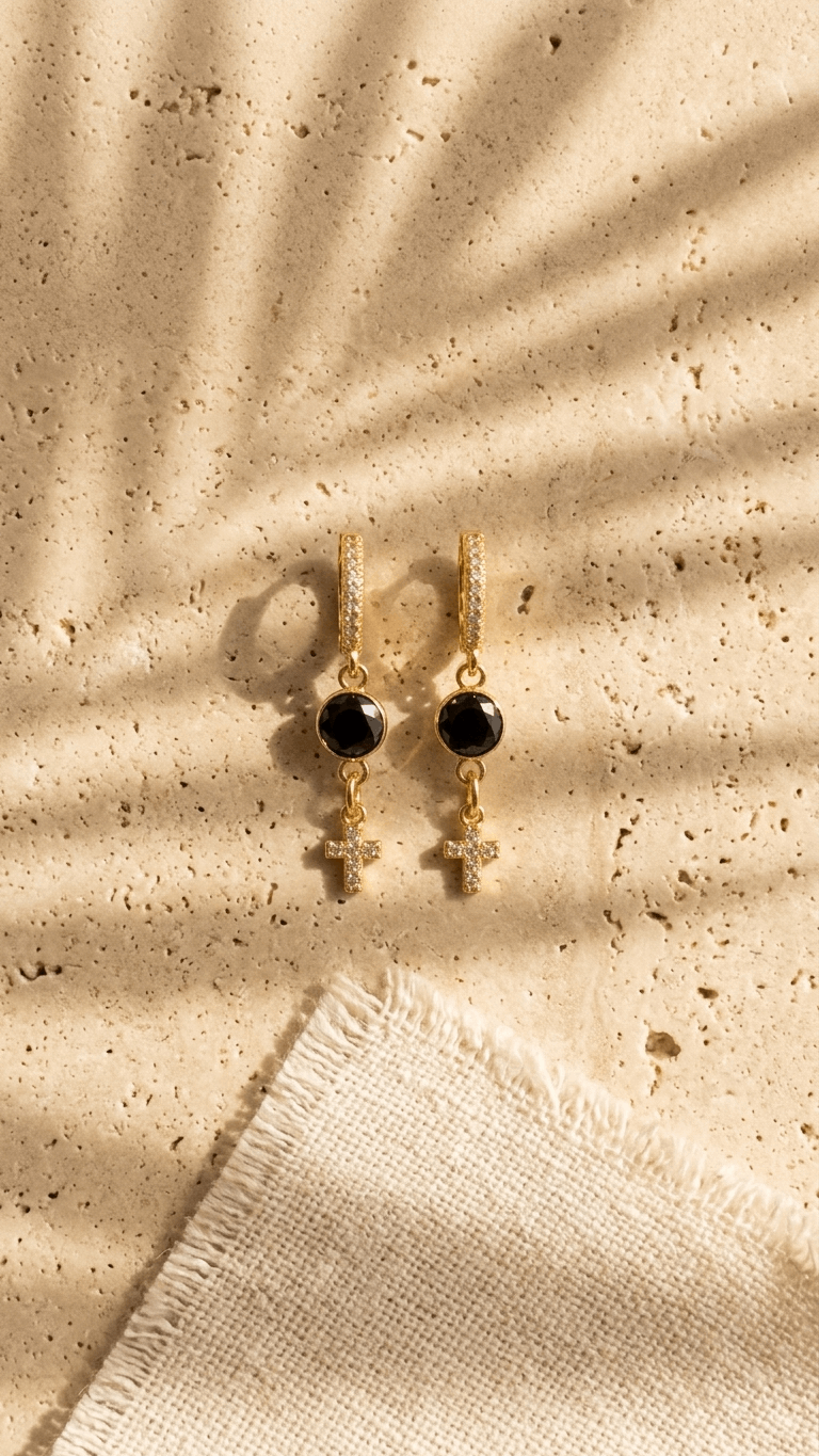 Gold-tone clip hoop earrings with black zircon round and white zircon cross dangles