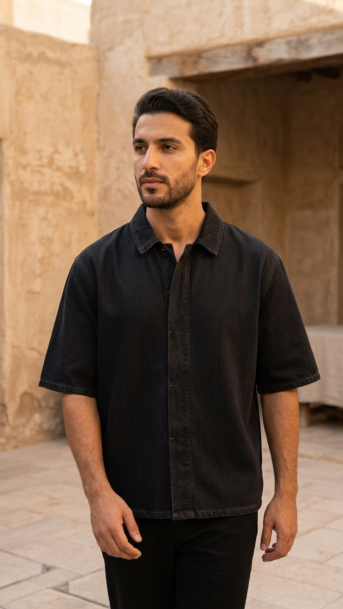 Black vintage-wash lyocell drop-shoulder button-up short-sleeve shirt on model