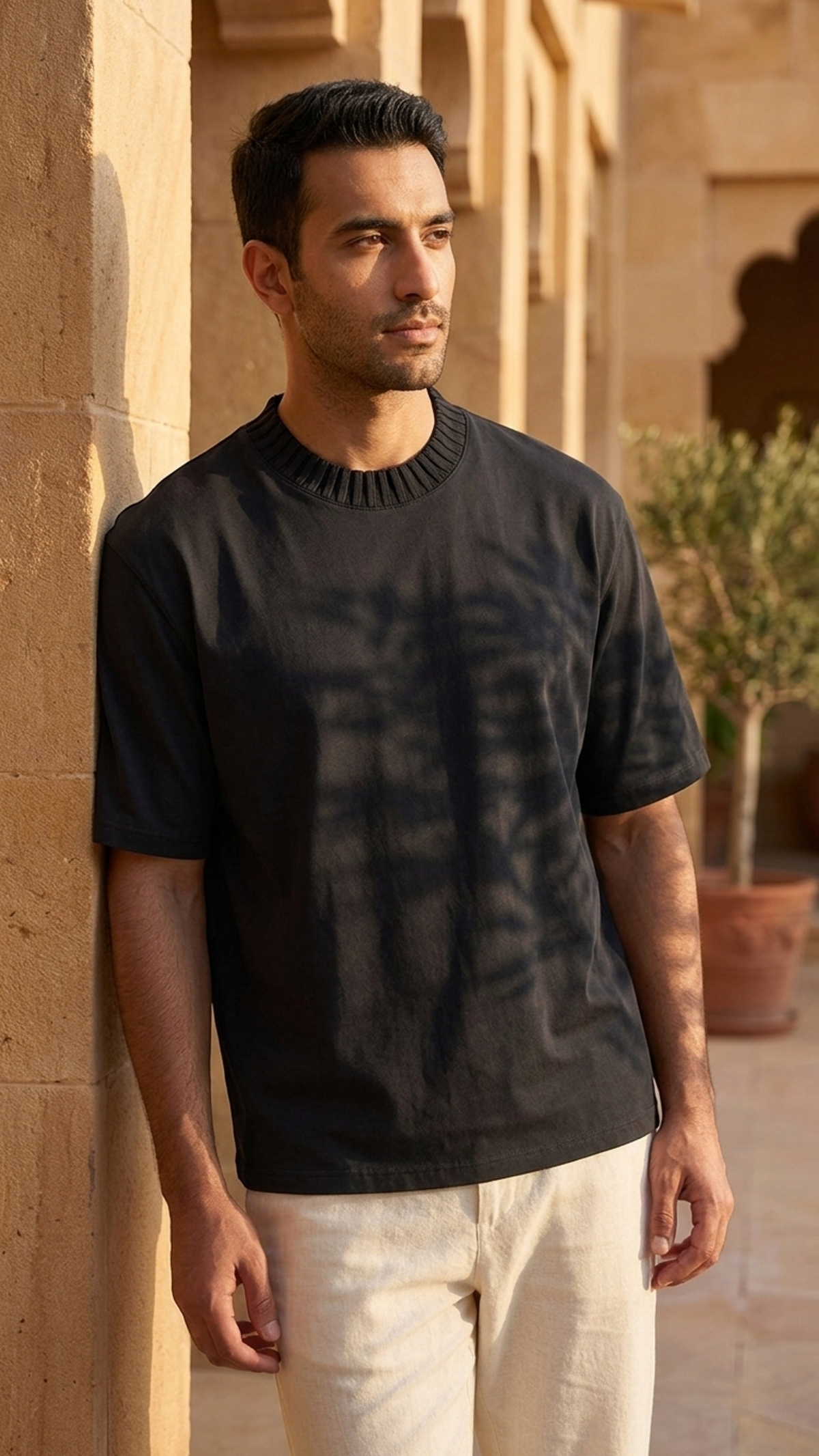 Men's black heavyweight knitted crew-neck t-shirt worn by model