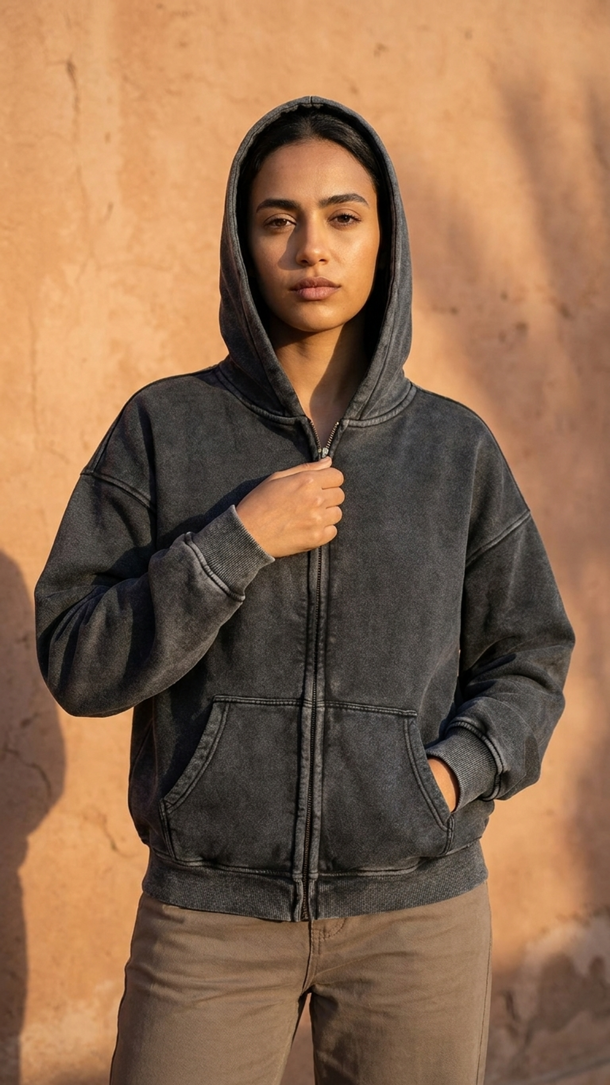 Black zip-through boxy fleece hoodie with hood, front zipper, and kangaroo pocket