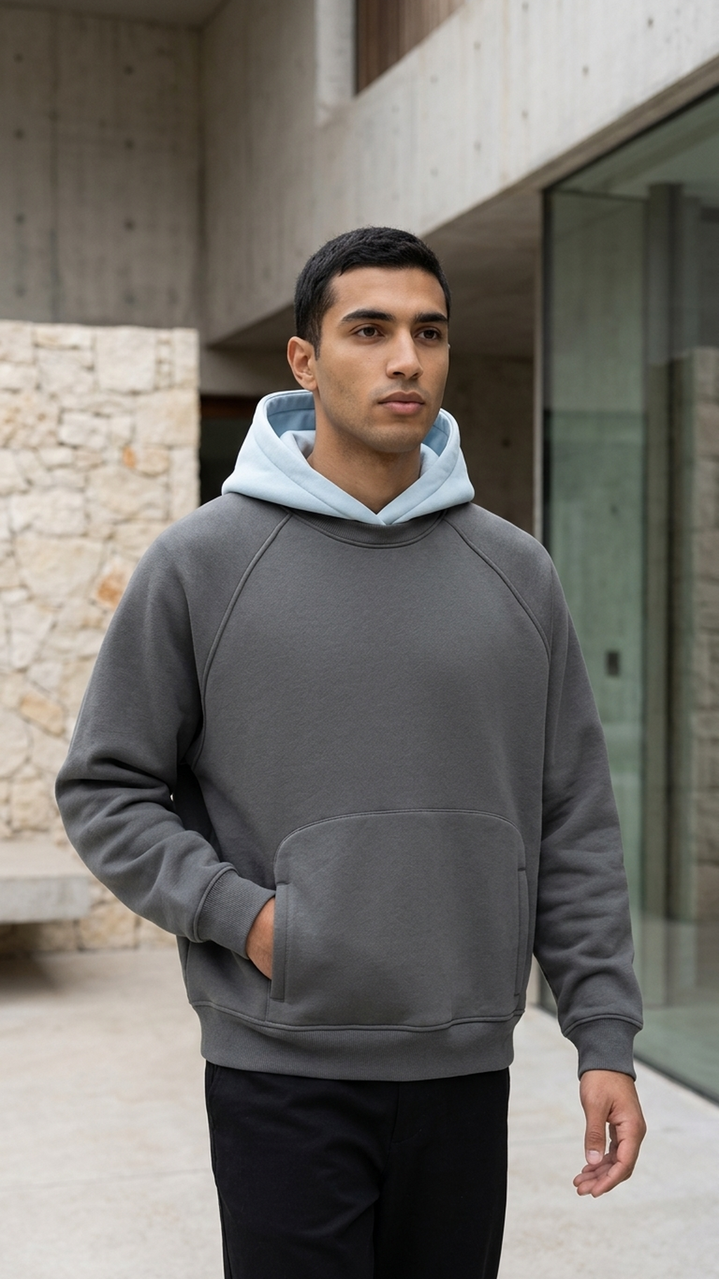 Fleece raglan hoodie with dark gray body, light blue hood, kangaroo pocket and cuffs