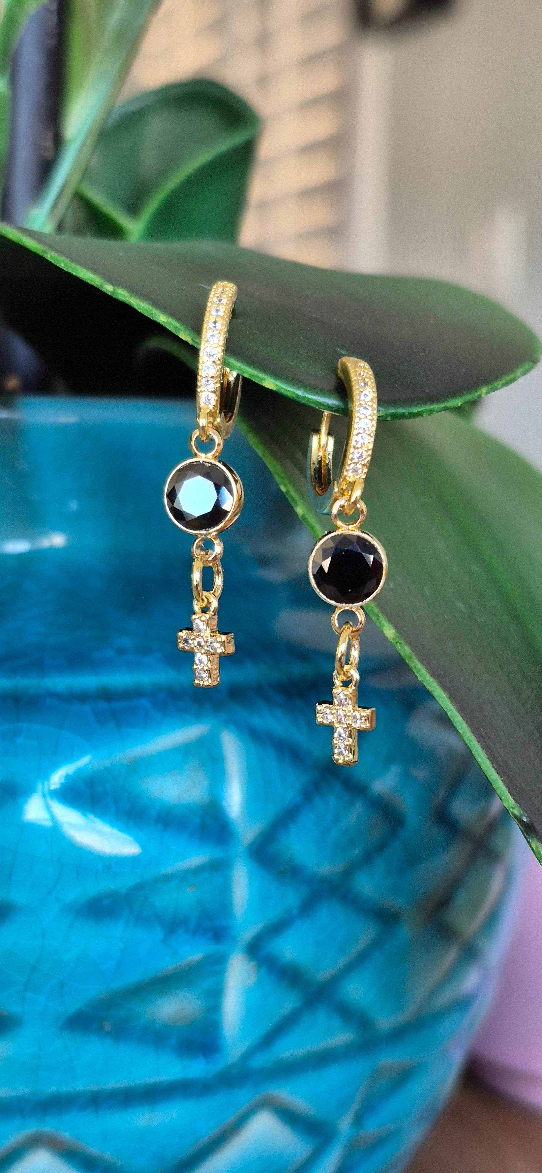 Gold huggie hoop earrings with black zircon circles and crystal cross drop charms